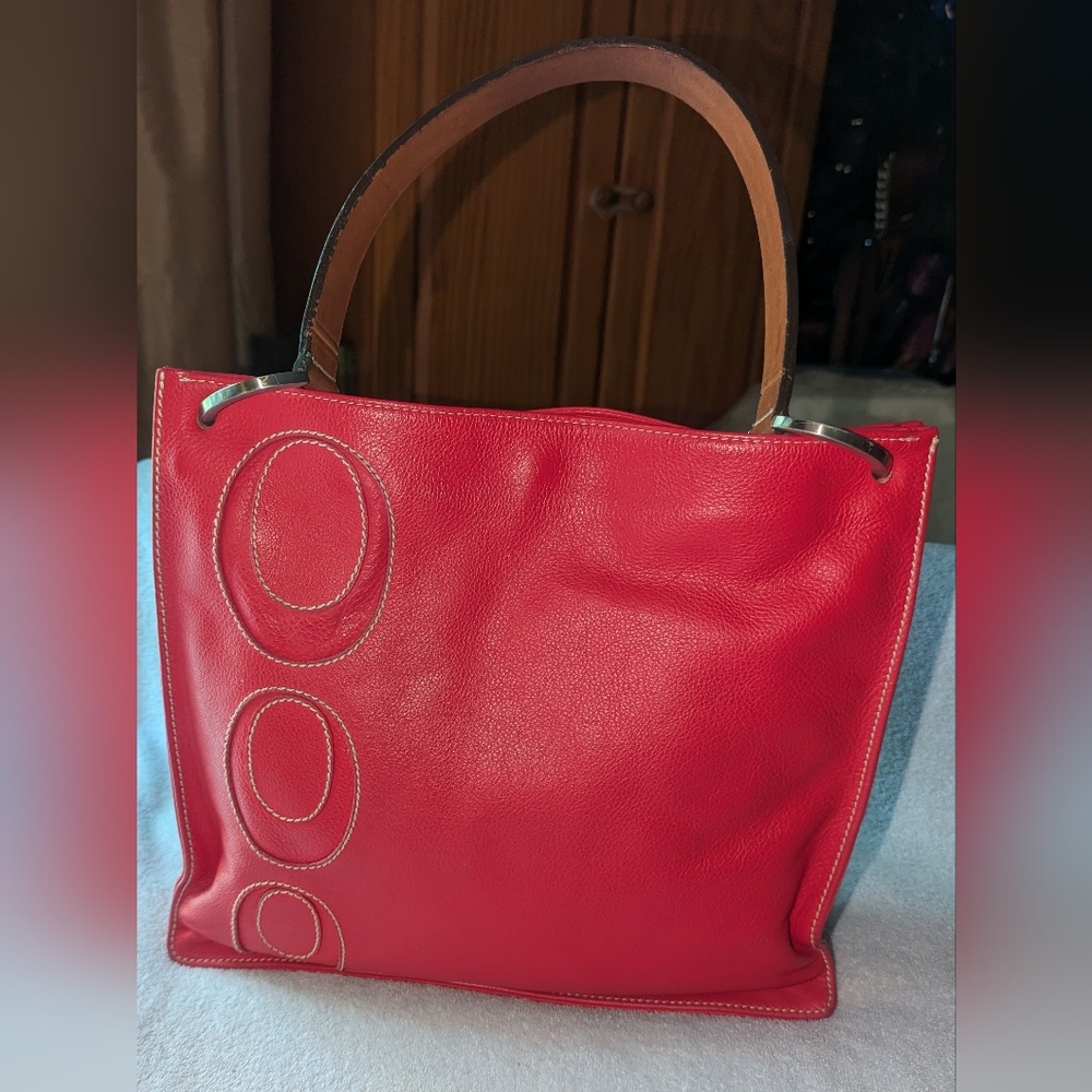 Luis Esteve red shoulder bag.